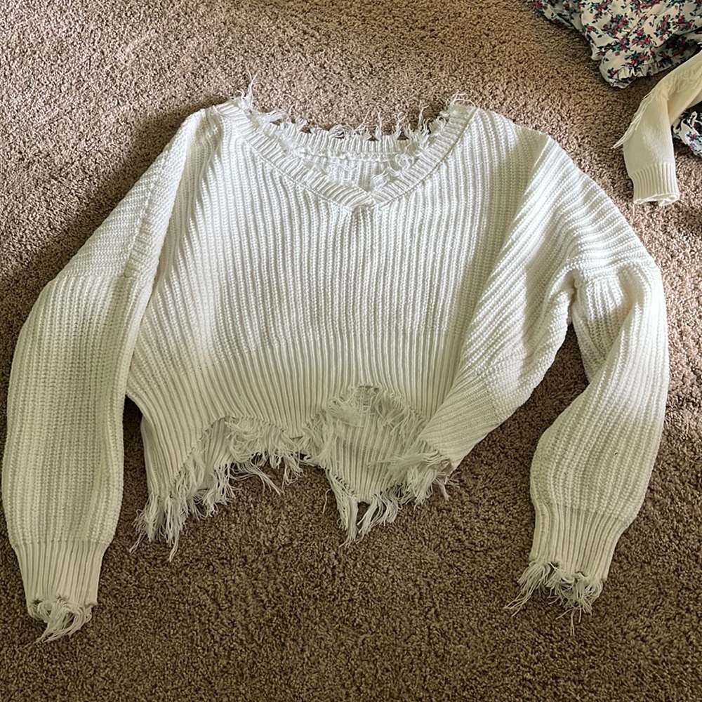 Distressed white sweater